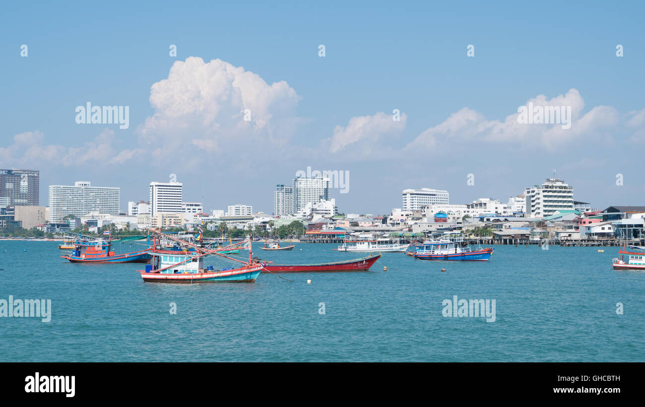 Ferry Boats and fishing boat sail in the sea, connecting Pattaya downtown city and Koh Larn, Famous island for traveling tourist Stock Photo