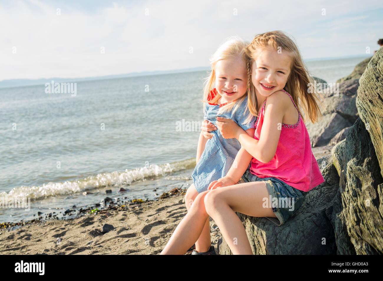 sisters at the beach on sunset Stock Photo - Alamy
