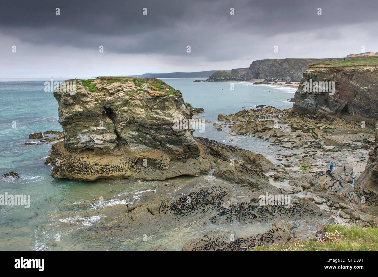 Dollar Rock exposed at low tide in Newquay, Cornwall. Stock Photo