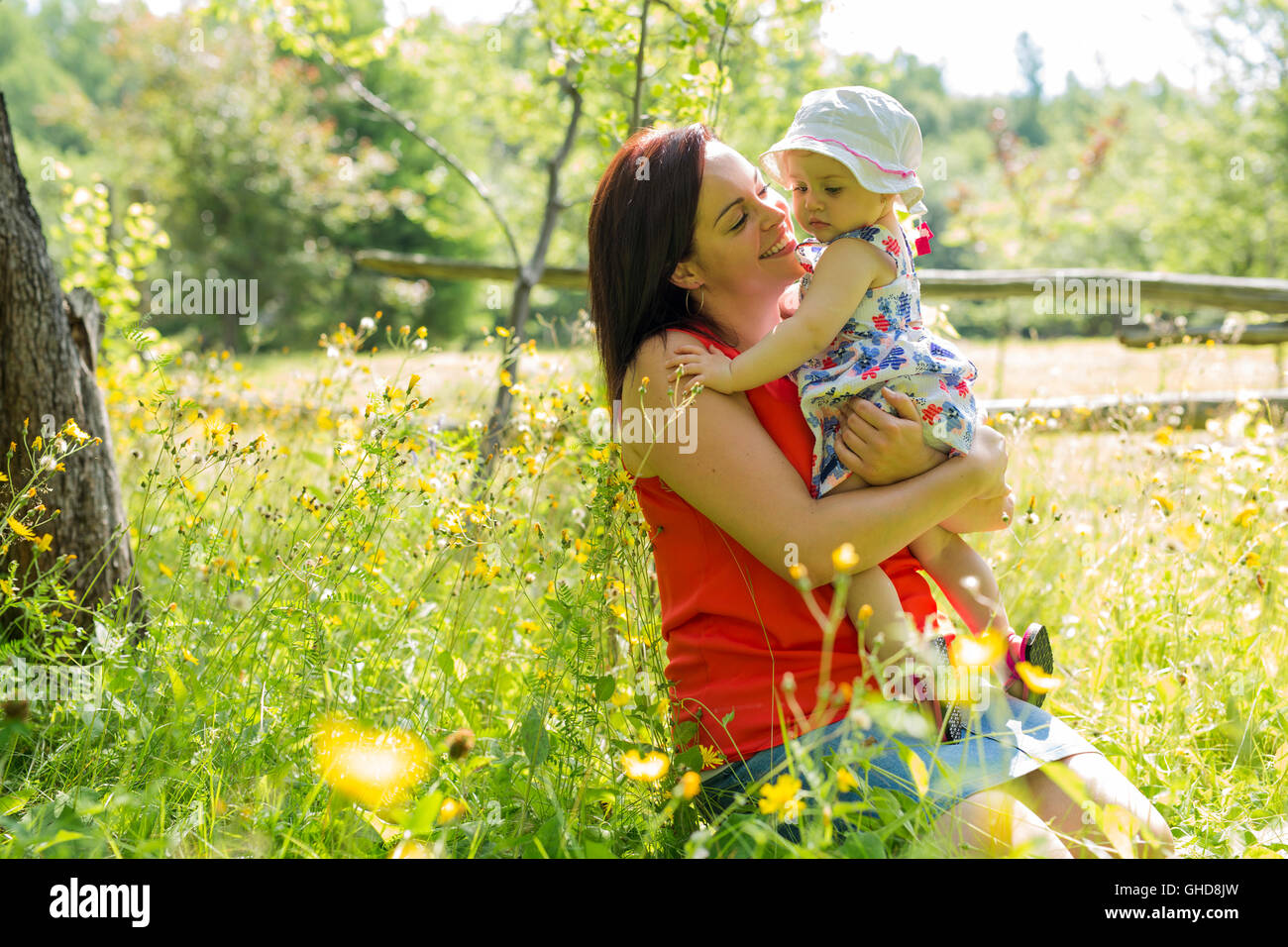Mother and daughter in forest having fun Stock Photo