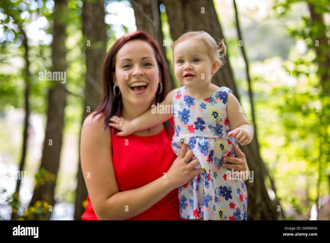 Mother and daughter in forest having fun Stock Photo
