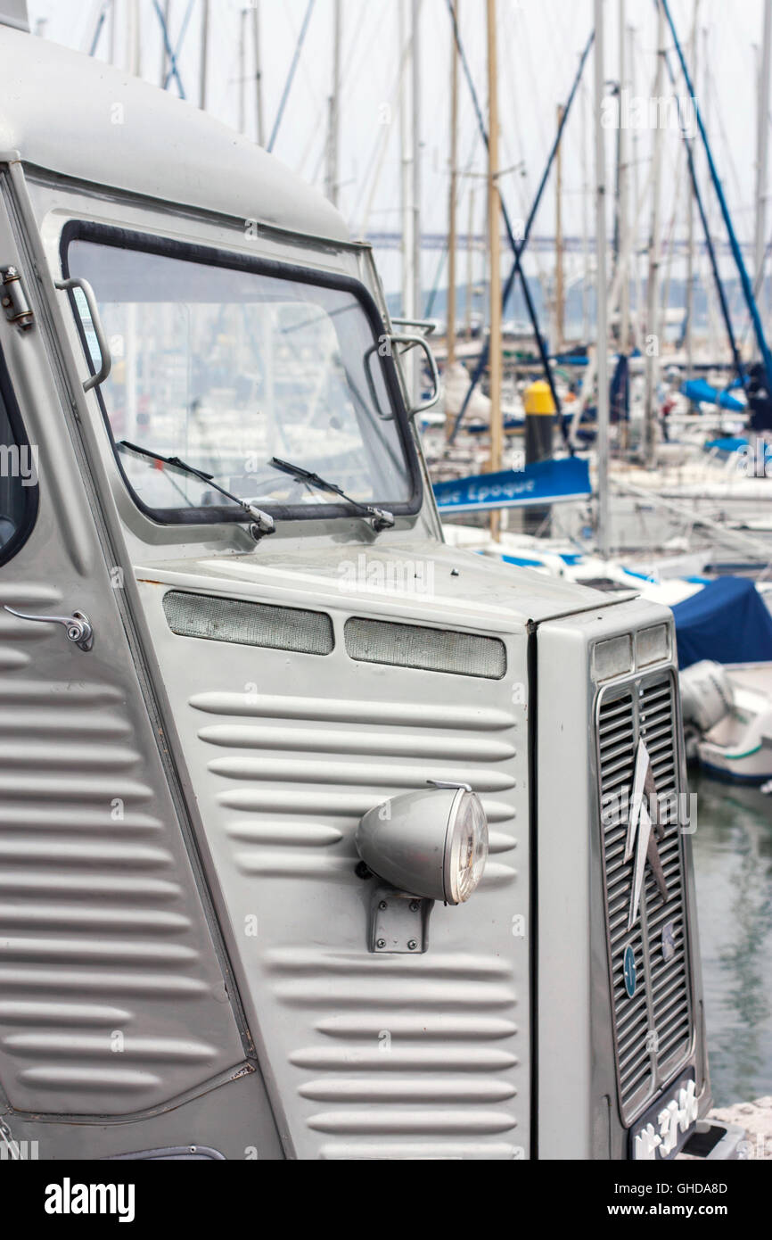 close up of vintage Citroen H van in front of boats in a marina Stock Photo