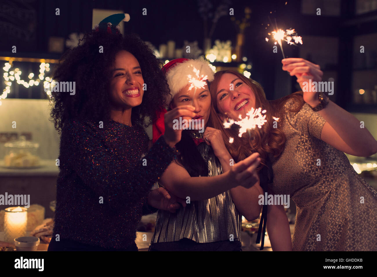 Playful young women with sparklers Stock Photo