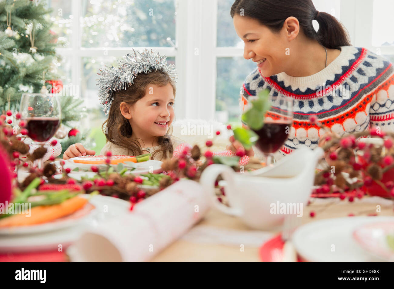 Mother and daughter enjoying Christmas dinner Stock Photo