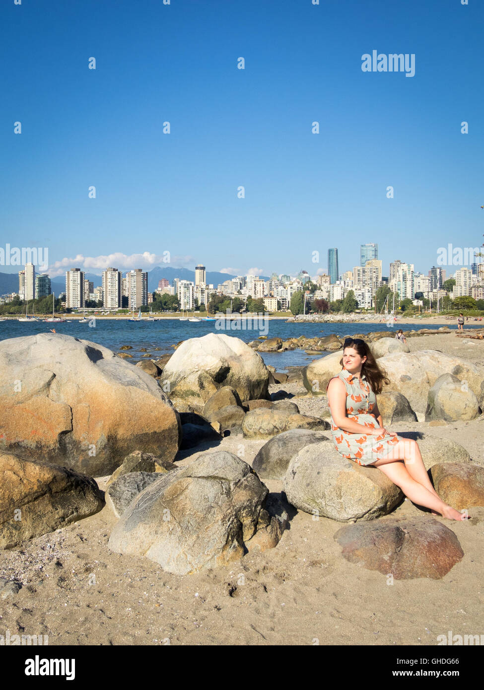 A beautiful young woman at Kitsilano Beach in Vancouver, British Columbia, Canada.  **MODEL RELEASE AVAILABLE UPON REQUEST** Stock Photo