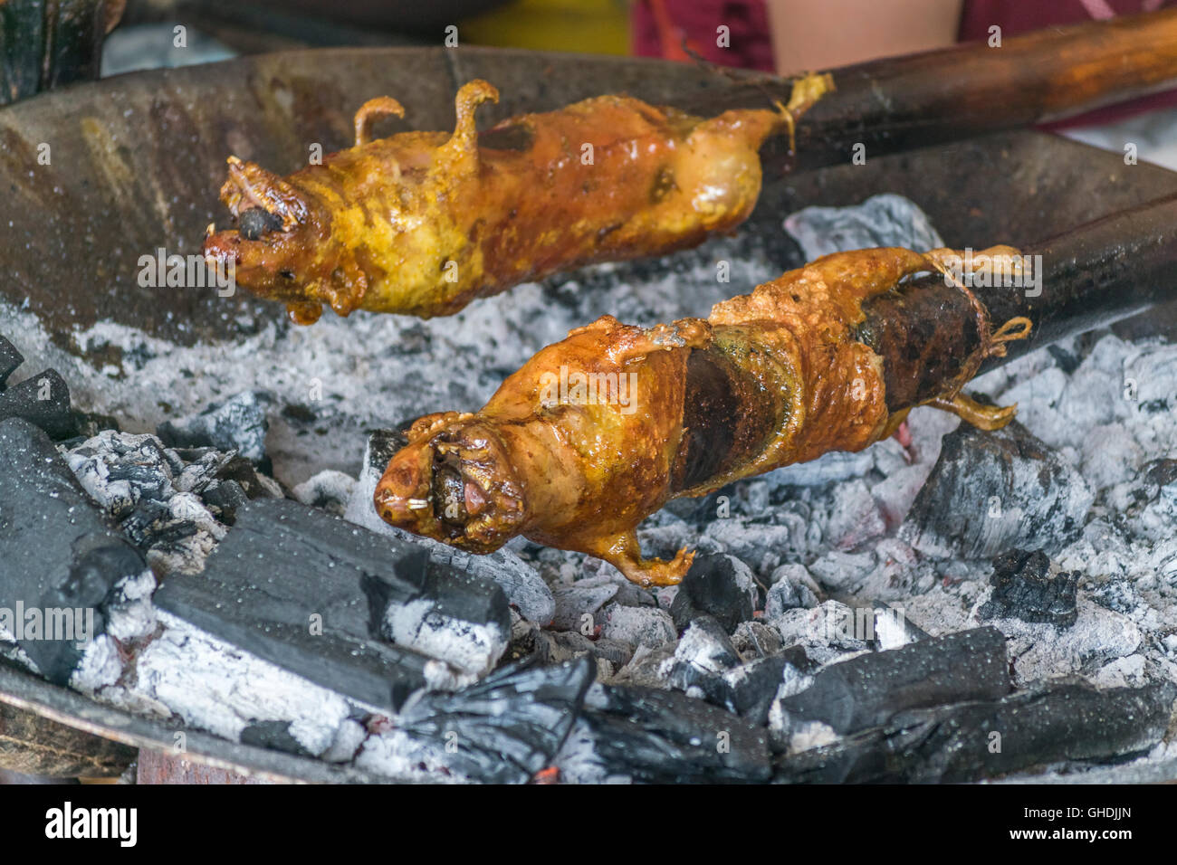Close up view of traditional roasted cuy at street market in Azuay province, Ecuador. Stock Photo