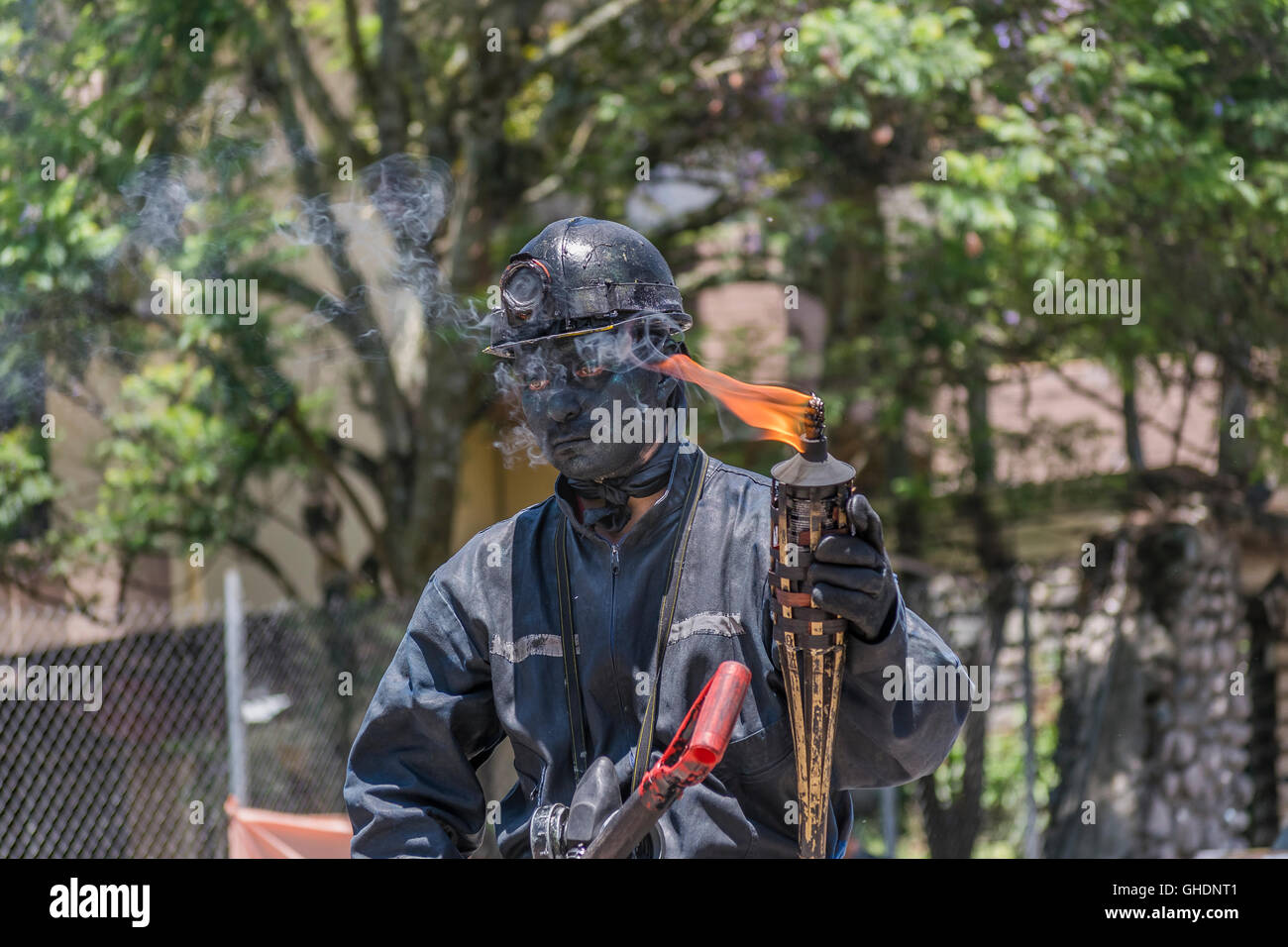 CUENCA, ECUADOR, NOVEMBER - 2015 -  Street performer man with miner costume at historic center of Cuenca, Ecuador Stock Photo