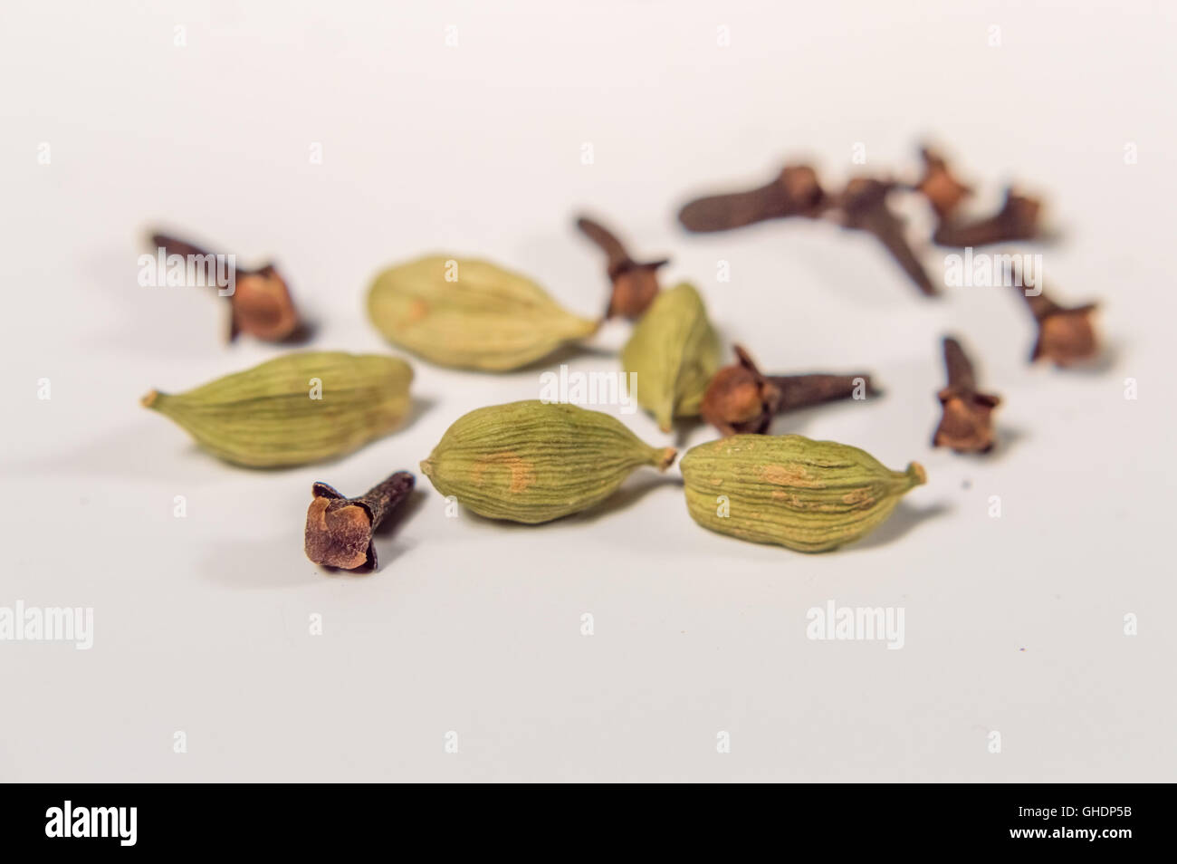 cardamom an cloves close up on a white background Stock Photo Alamy