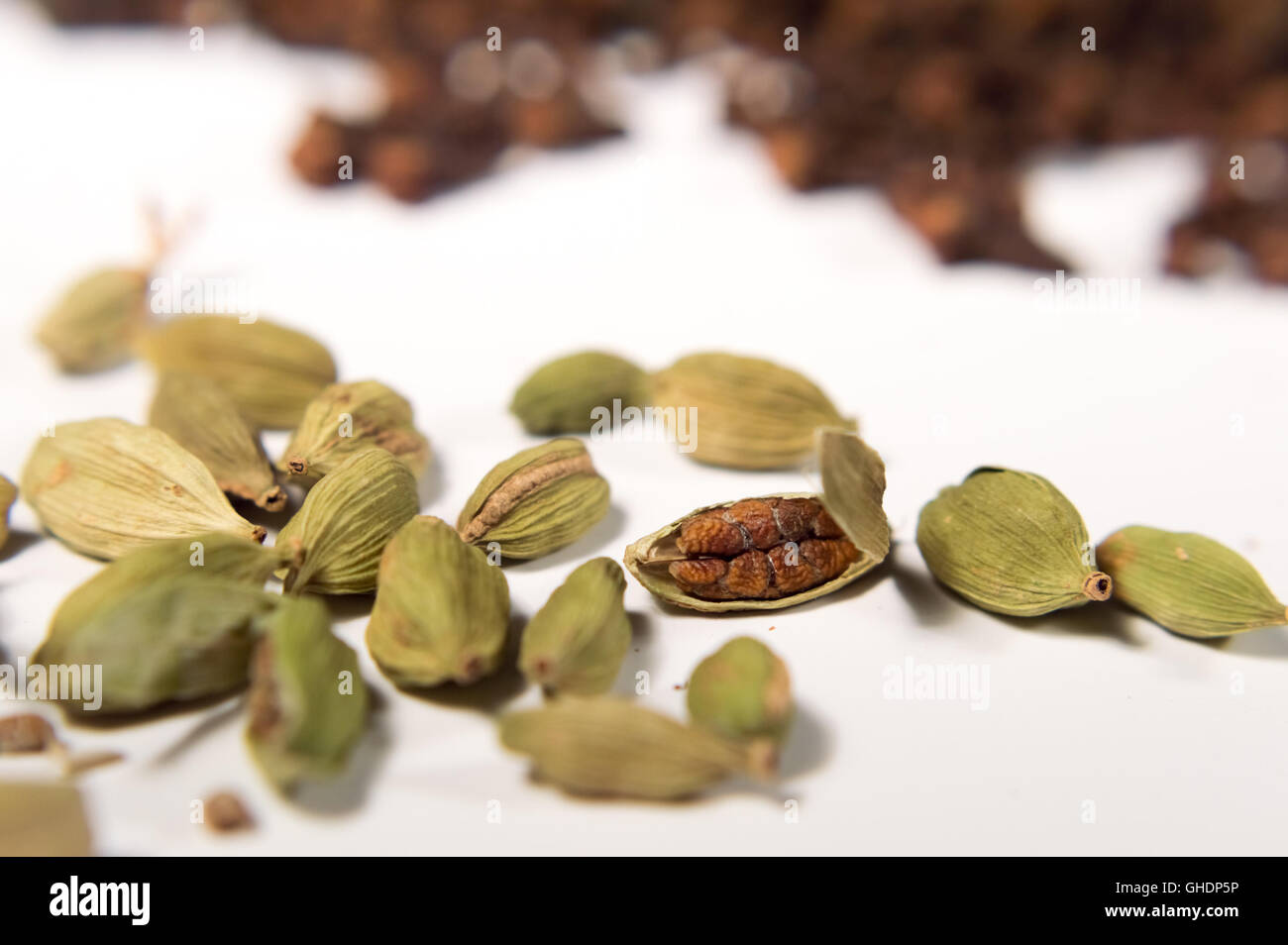 cardamom an cloves close up on a white background Stock Photo Alamy