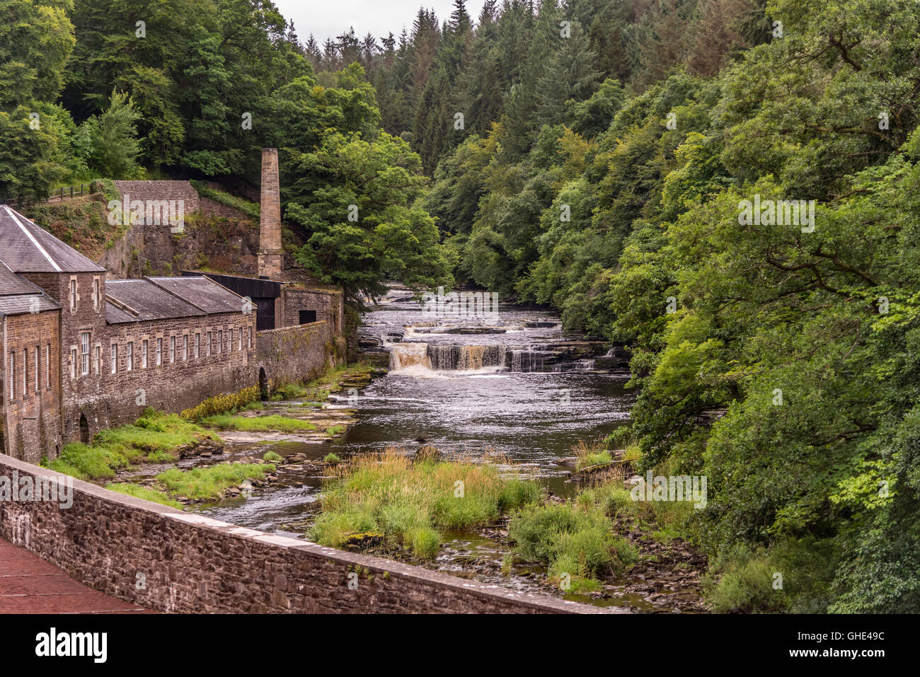 New Lanark is a village on the River Clyde, near Lanark, Lanarkshire, It was founded in 1786 by David Dale. The Falls of Clyde. Stock Photo