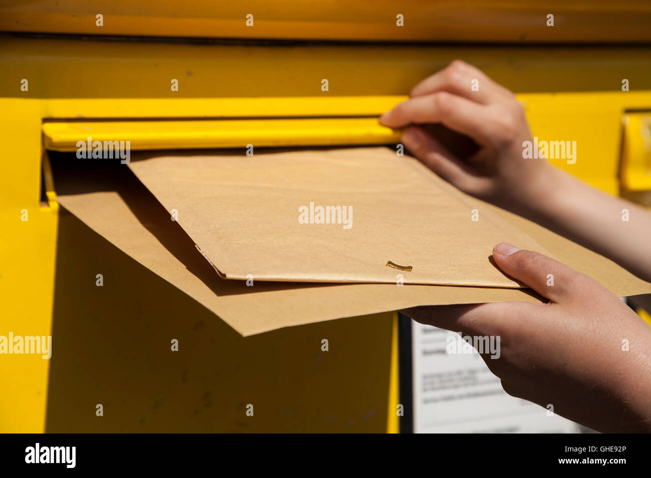 Letters into mailbox Stock Photo Alamy