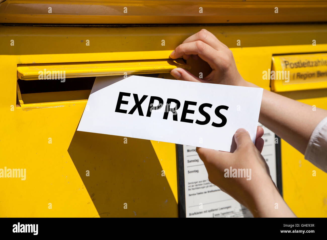 "express" letter into mailbox Stock Photo Alamy