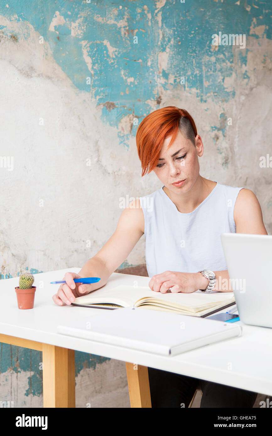 Young woman looks at agenda commitments Stock Photo