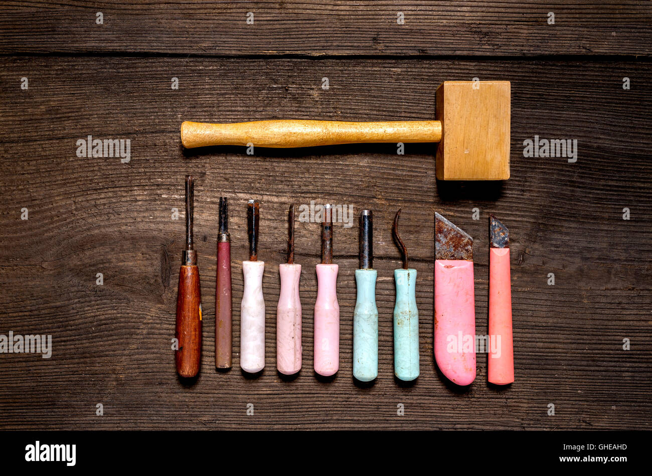 Sculptor tools at the old wooden table, chisel, hammer Stock Photo Alamy