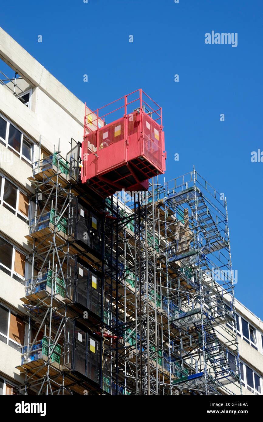 safety cage and scaffolding on side of building england uk Stock Photo
