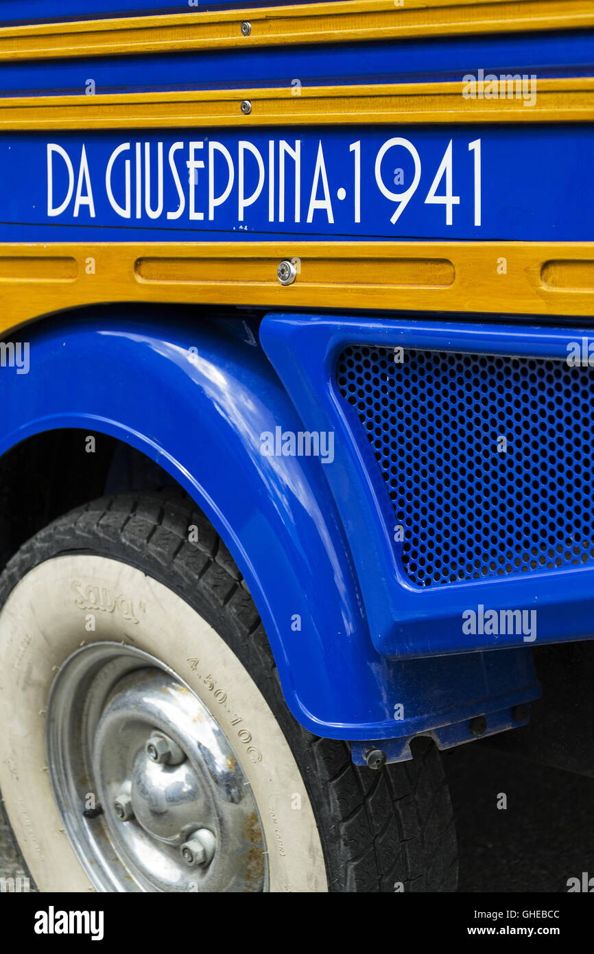 Limited edition model of three-wheeled vehicle Piaggio Ape Calessino stands on street on 1 August 2016 in Livigno, Italy. Stock Photo