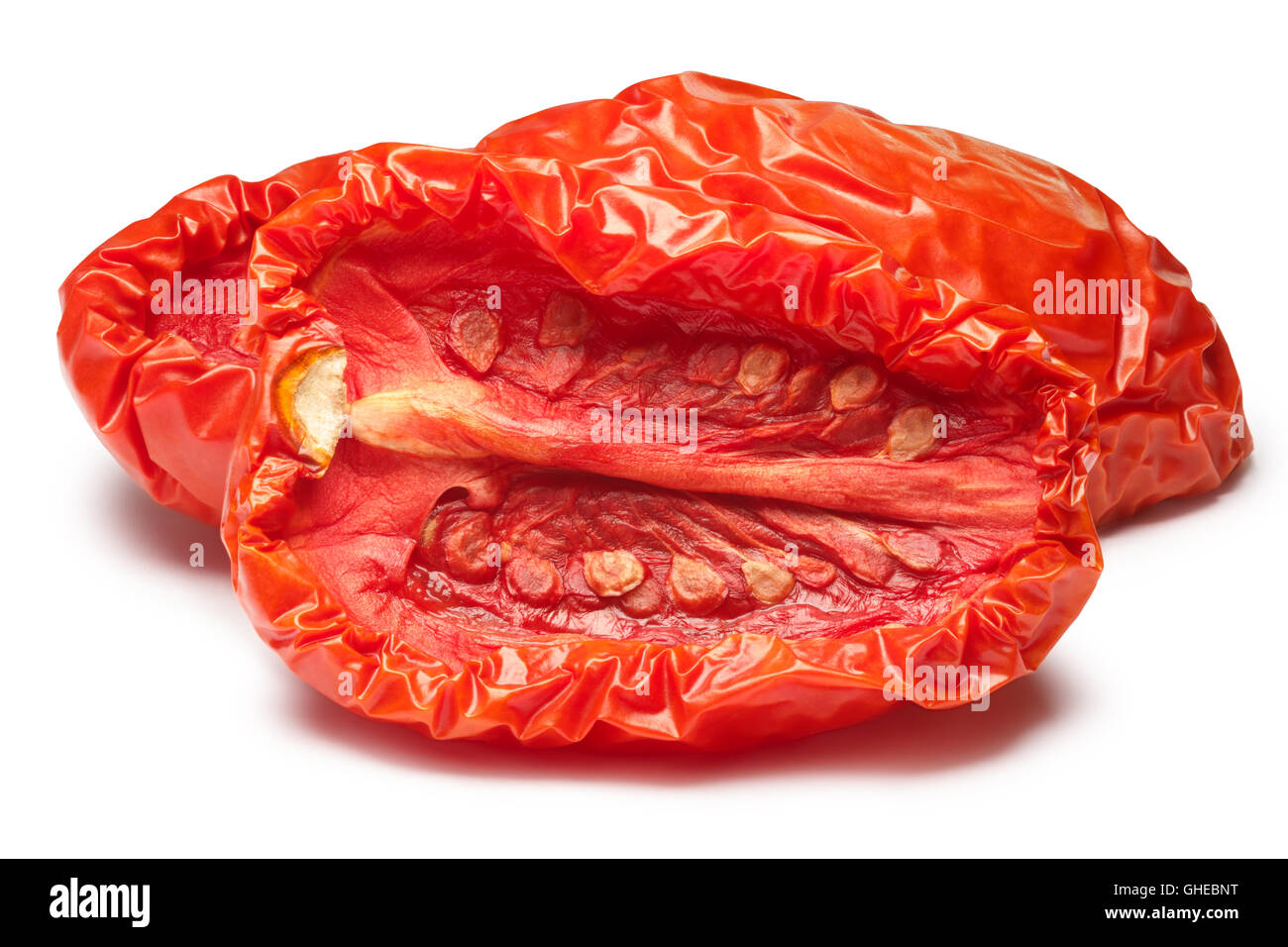 Sun dried tomatoes halved, medium residual moisture content, with seeds. Clipping paths, shadow separated, infinite depth of fie Stock Photo