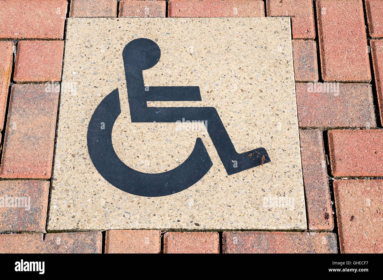 Sign for disabled parking embedded in ground surface of car park Stock Photo