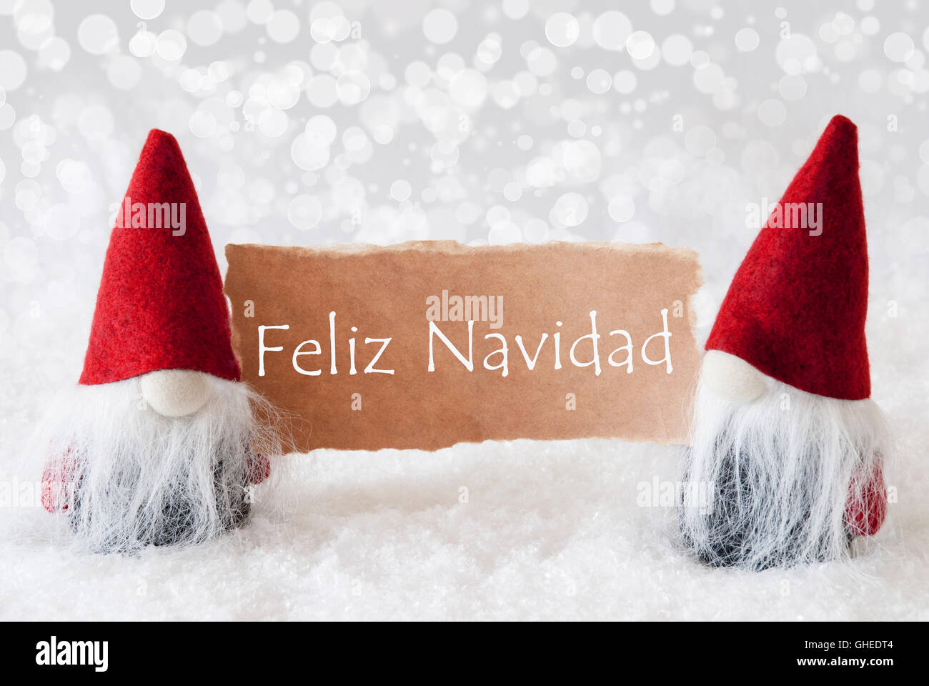 Red Gnomes With Card, Feliz Navidad Means Merry Christmas Stock Photo