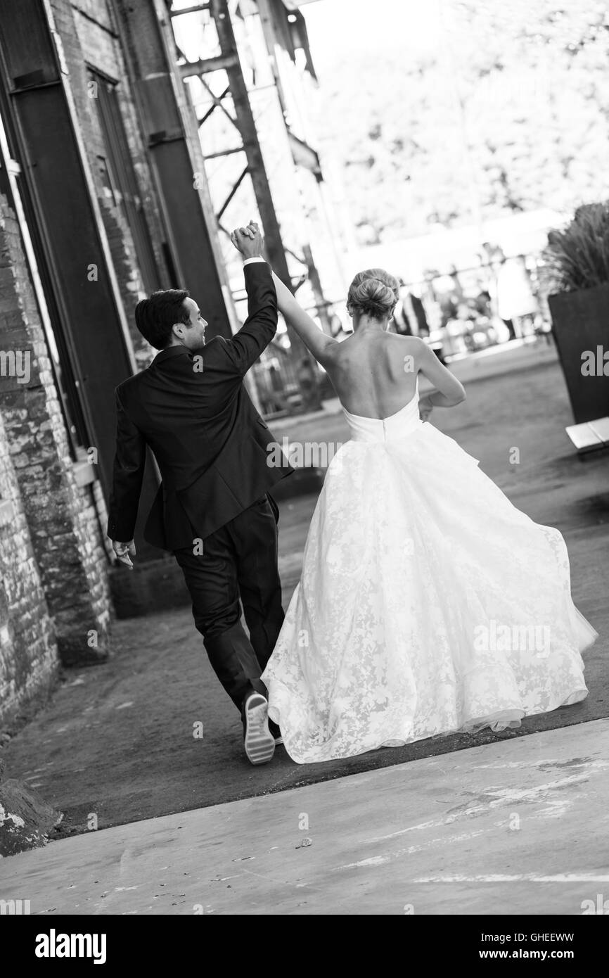 Groom walking with bride hi-res stock photography and images - Alamy