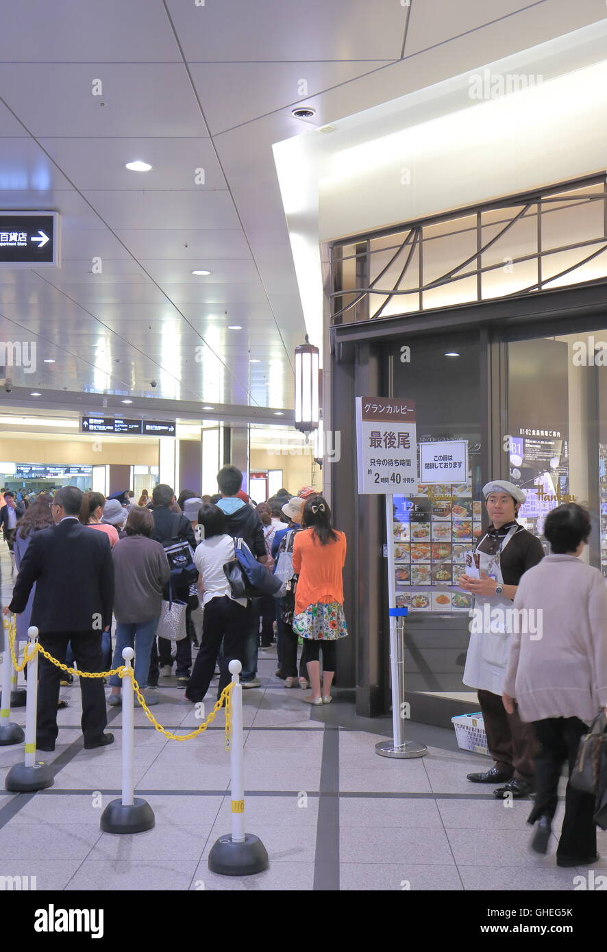 People queue for 2.5 hours to buy Grand Calbee at Grand Calbee shop in Umeda in Osaka Japan. Stock Photo