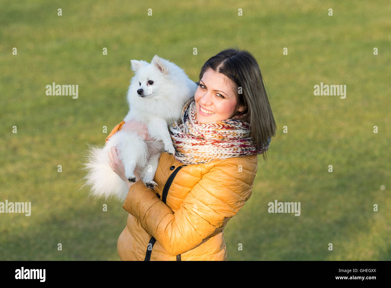 Happy girl with her little dog in nature Stock Photo - Alamy