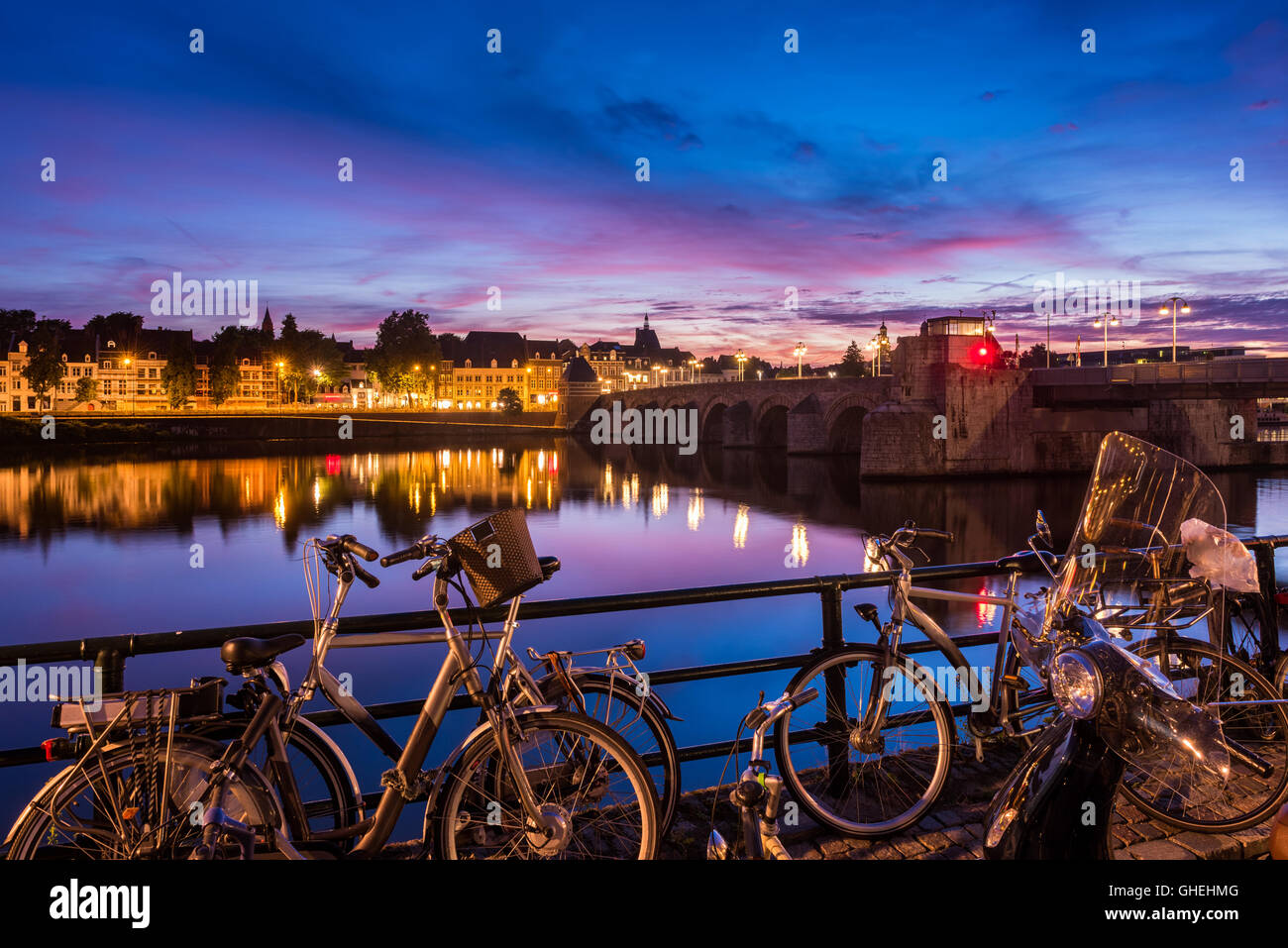 Bicycles at River Maas in Maastricht Netherlands Stock Photo