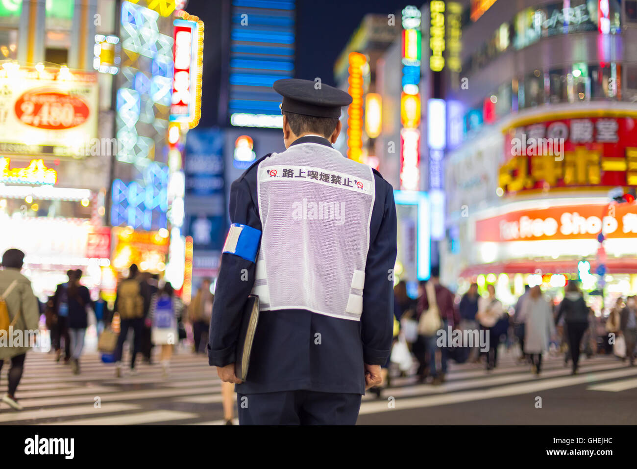 Japanese policeman standing in Shinjuku, Tokyo, Japan. Stock Photo