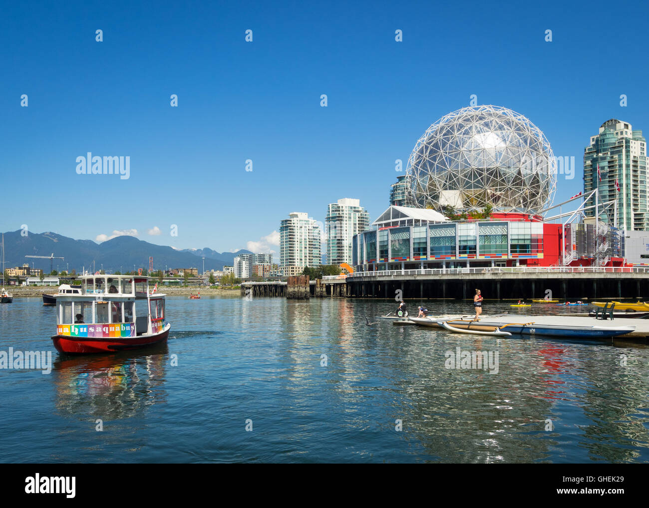 A view of an Aquabus and Science World at Telus World of Science on False Creek in Vancouver, British Columbia, Canada. Stock Photo