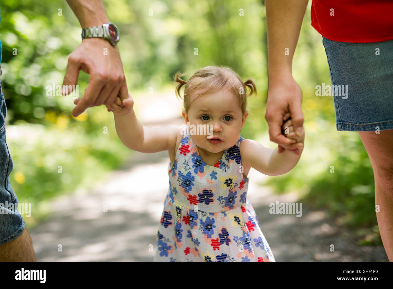 Little girl in the forest park Stock Photo - Alamy