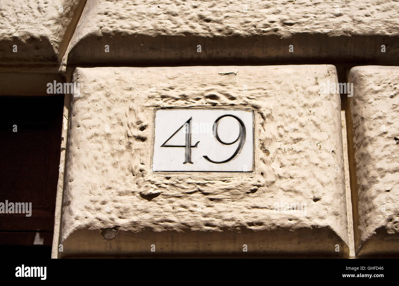 Engraved old building number 49 in Rome Stock Photo