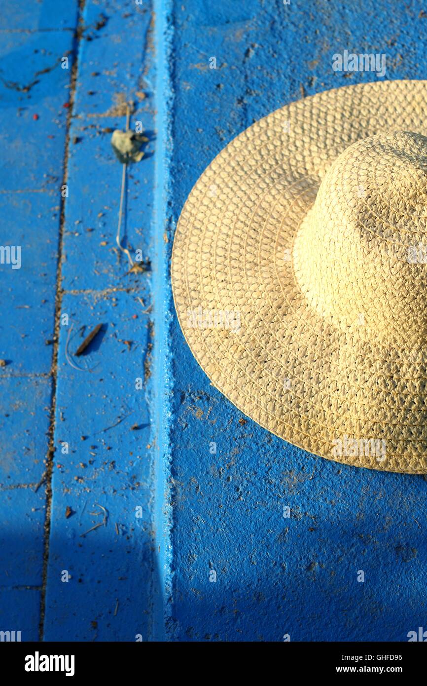 summer straw hat on a blue background Stock Photo