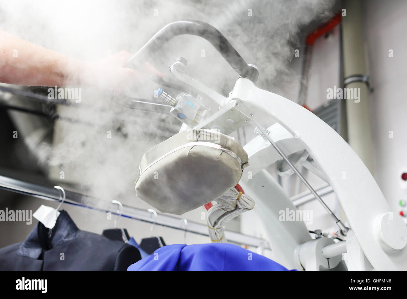 Presser in sewing clothes pressed Stock Photo Alamy