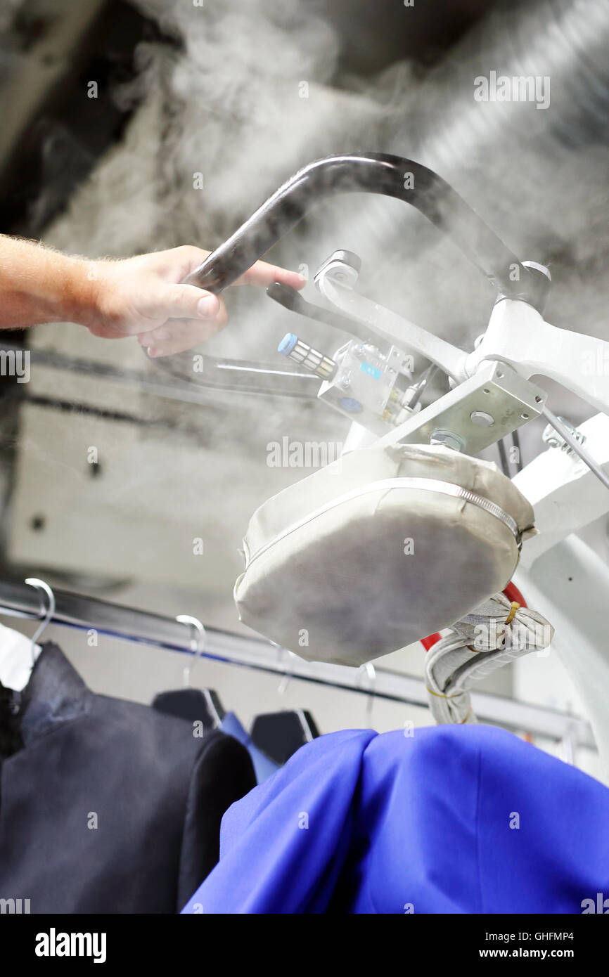 Presser in sewing clothes pressed Stock Photo Alamy