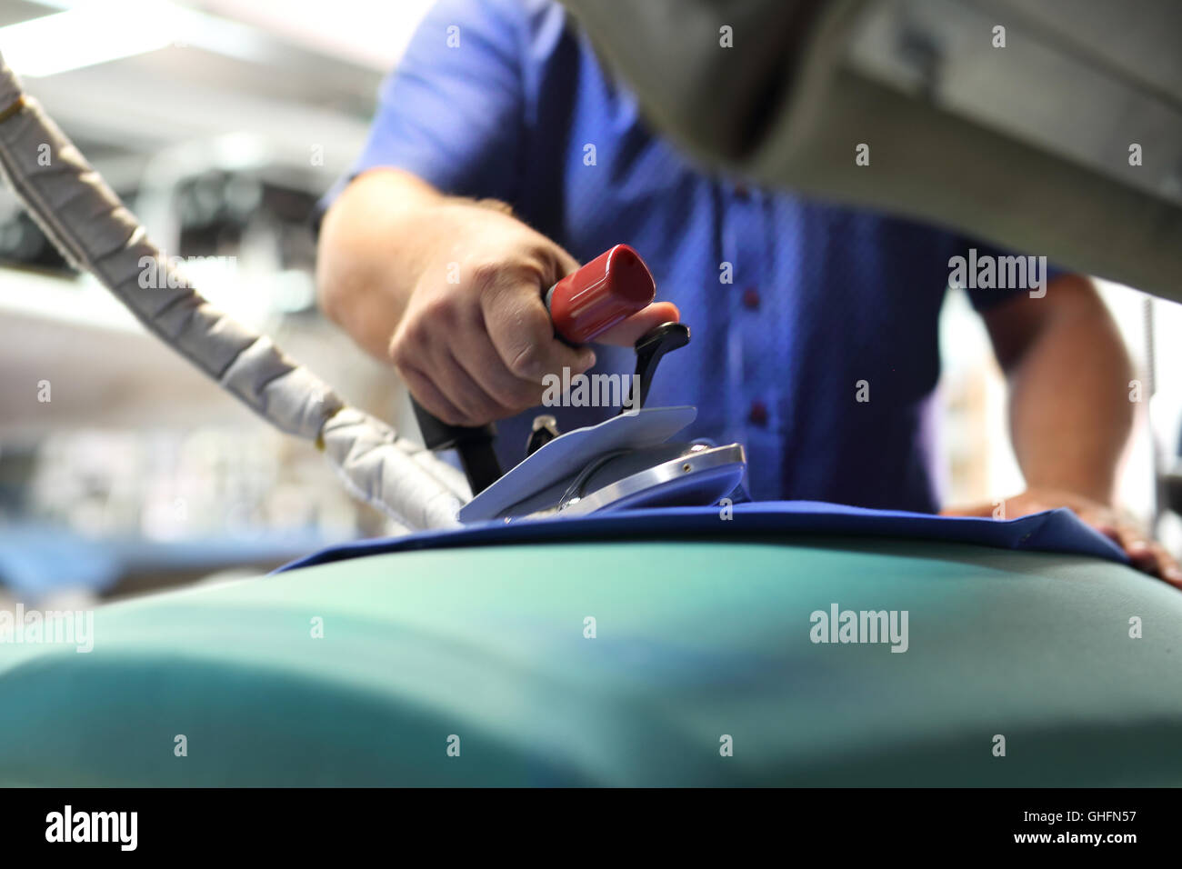 Clothing industry. Ironing steam. Stock Photo