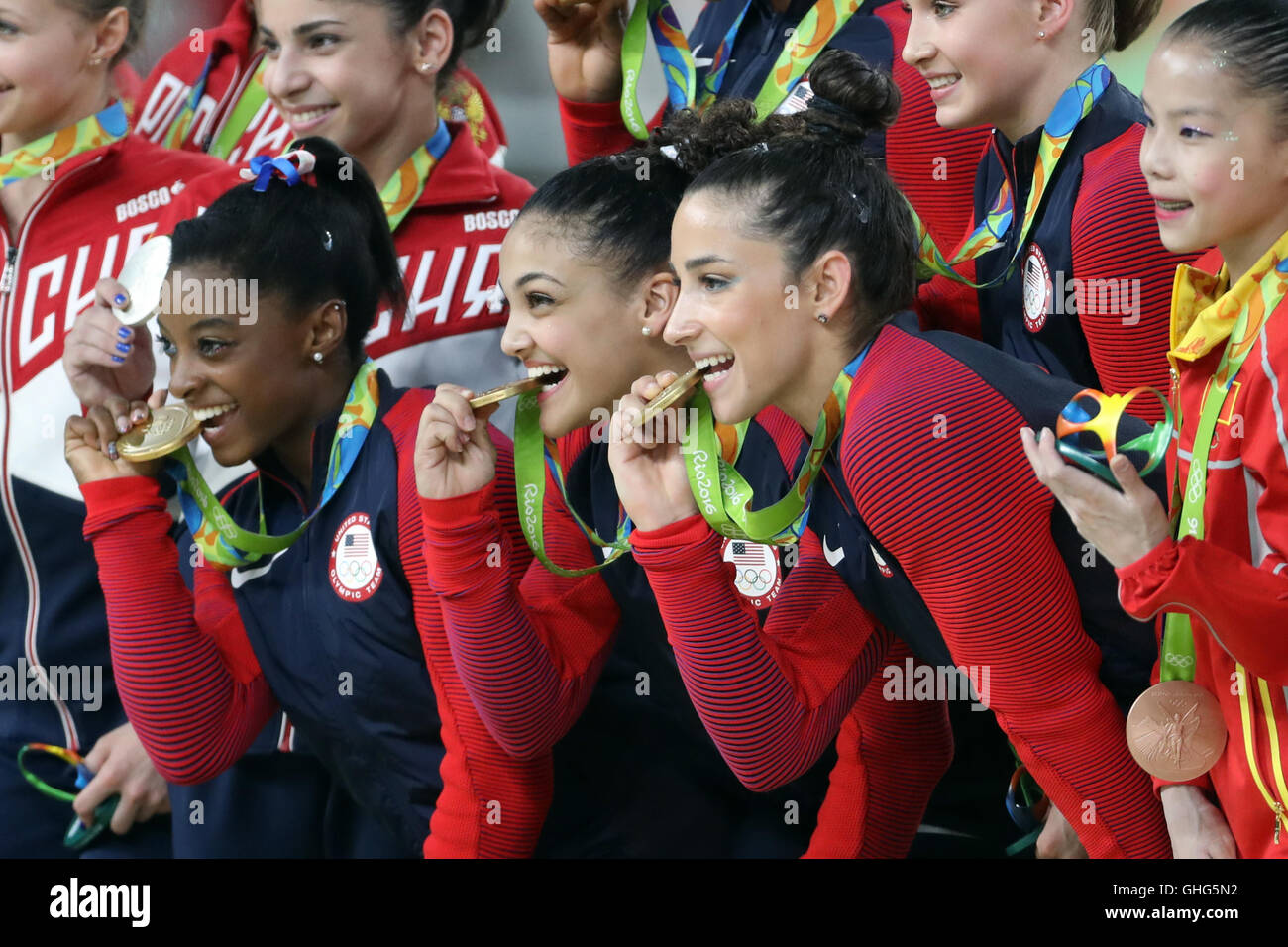 The USA team celebrate victory in the Women's Team Gymnastics final at
