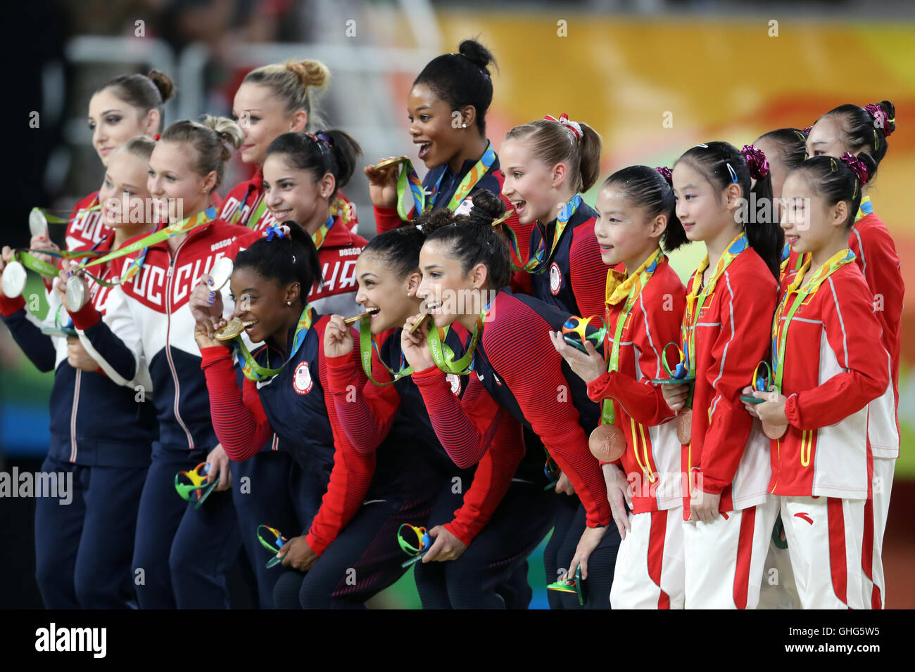 The USA team celebrate victory in the Women's Team Gymnastics final at