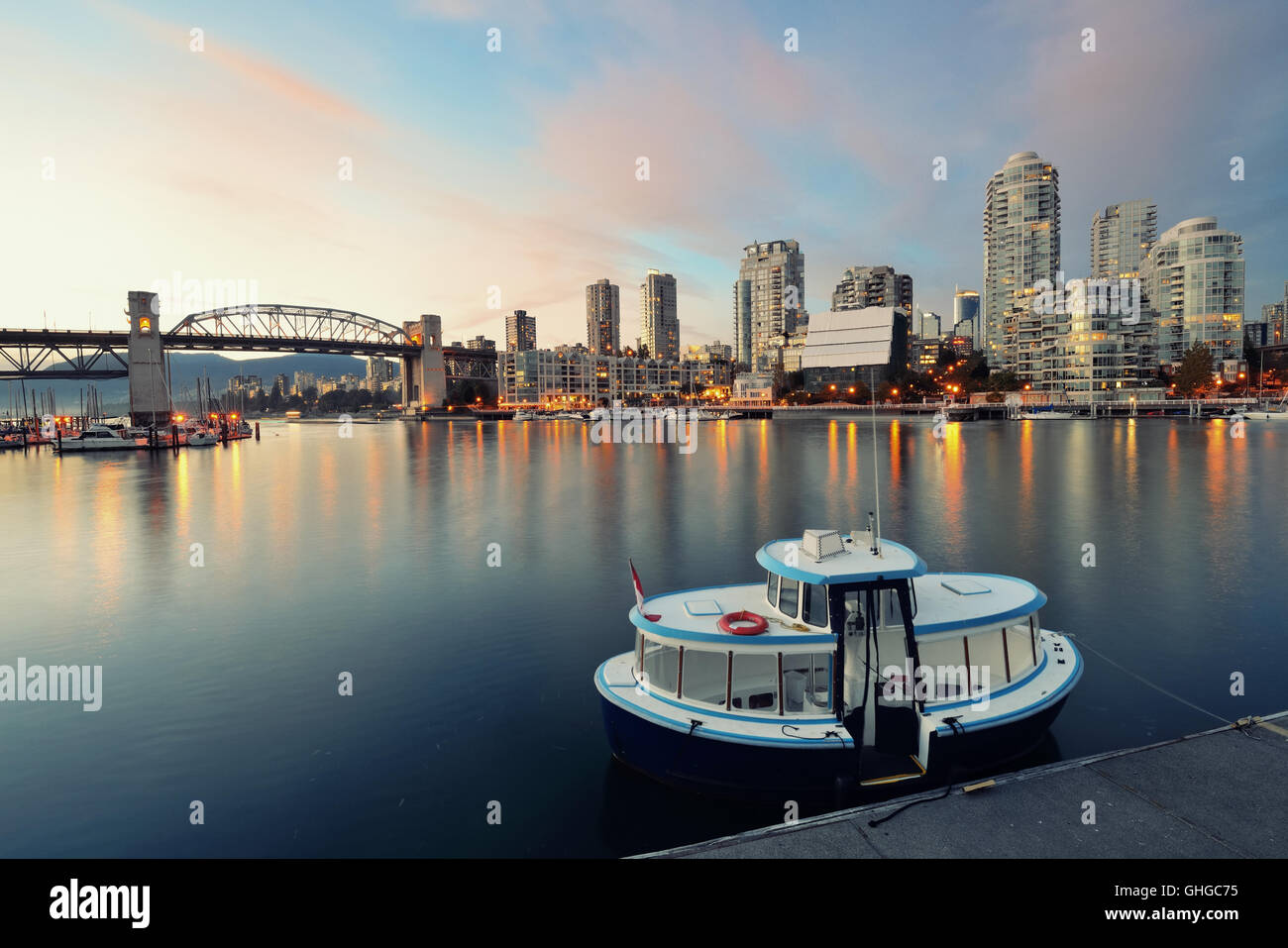 Vancouver False Creek at sunset with bridge and boat Stock Photo - Alamy