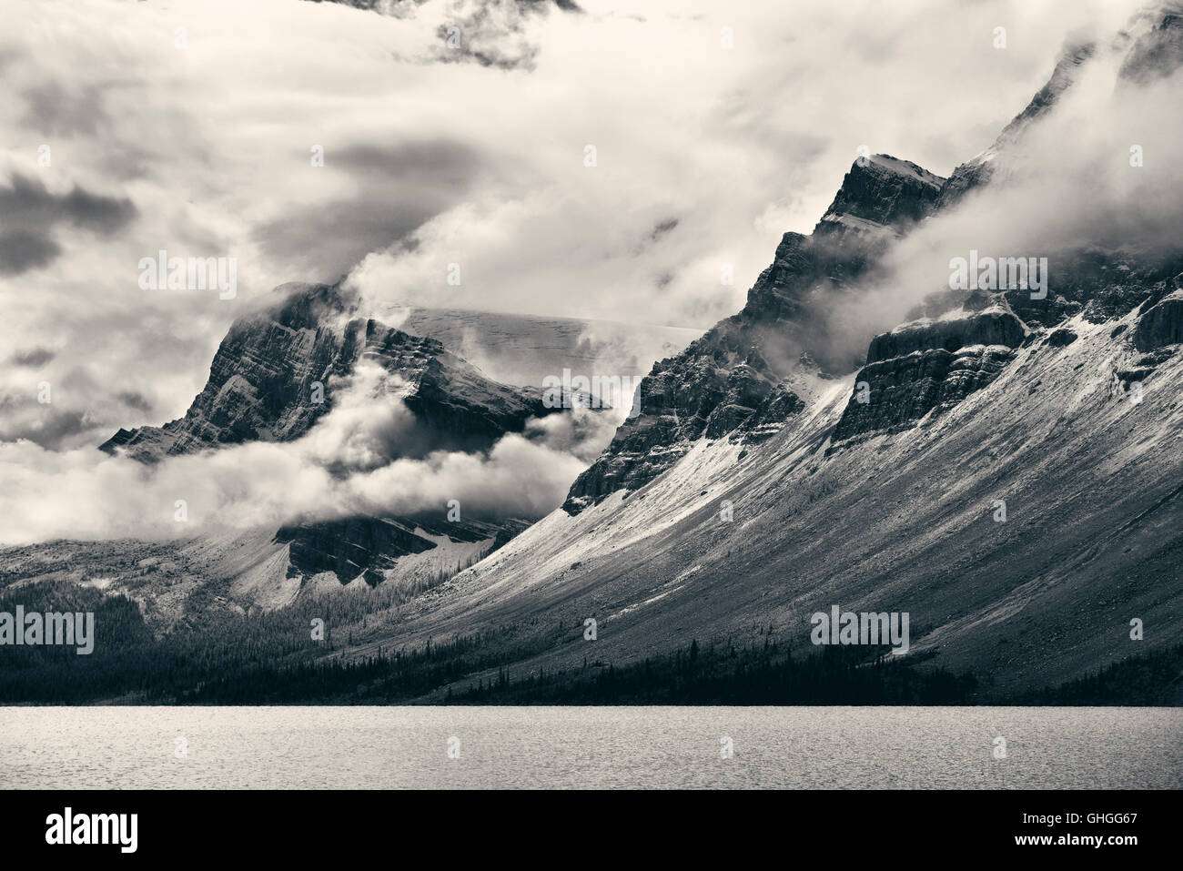 Snow Mountain with fog and lake forest Stock Photo - Alamy