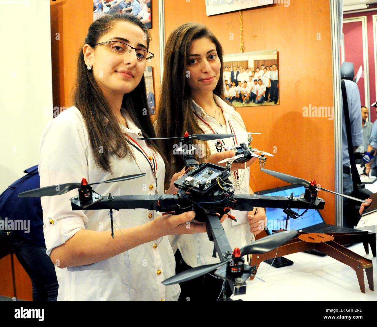 Damascus, Syria. 9th Aug, 2016. Two girls showcase a drone they jointly ...