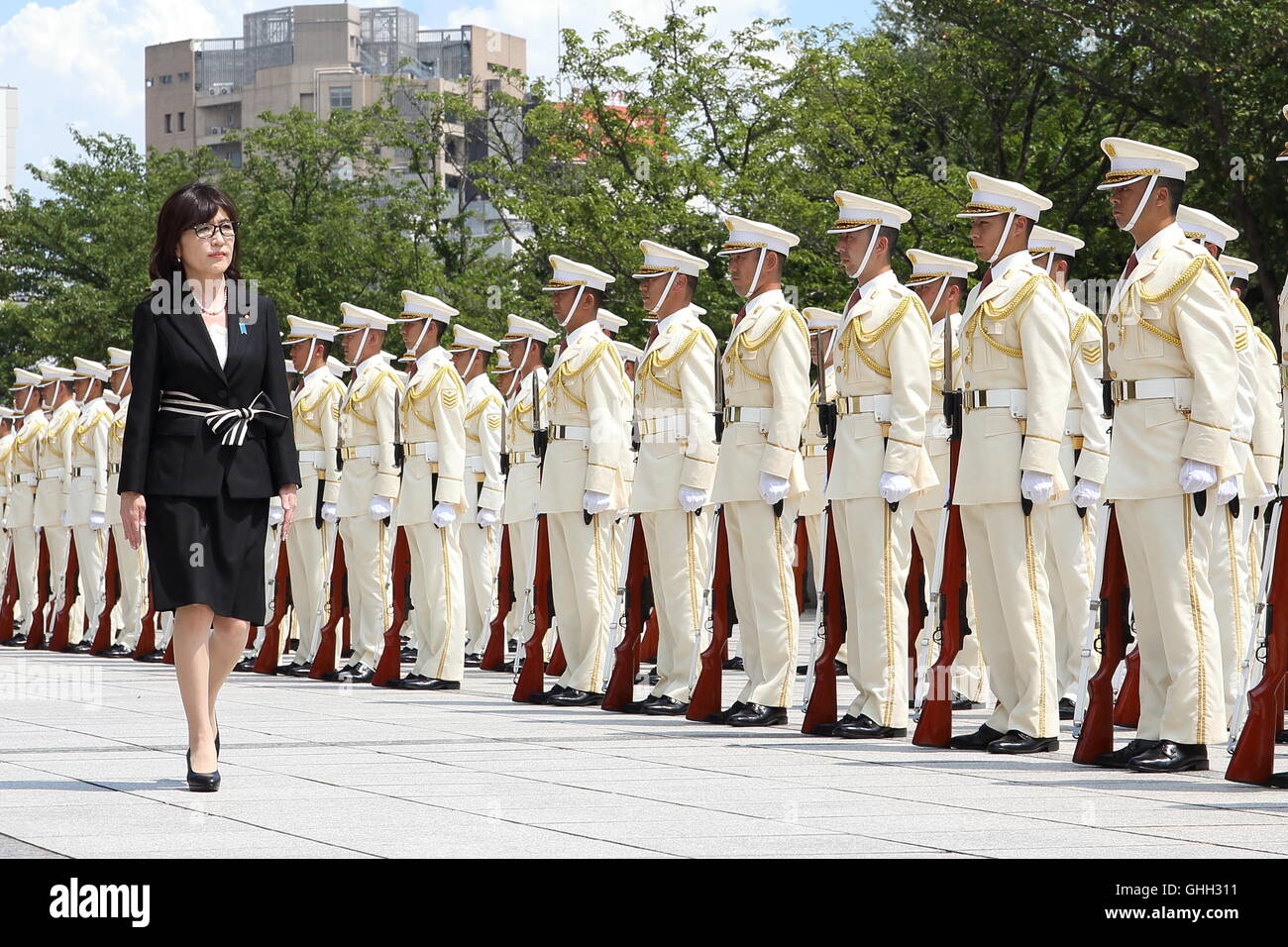 Newly appointed defense minister of Japan, Tomomi Inada reviews a guard of honor during a welcoming ceremony at the Ministry of Defense in Tokyo Japan on 04 Aug 2016. © Motoo Naka/AFLO/Alamy Live News Stock Photo