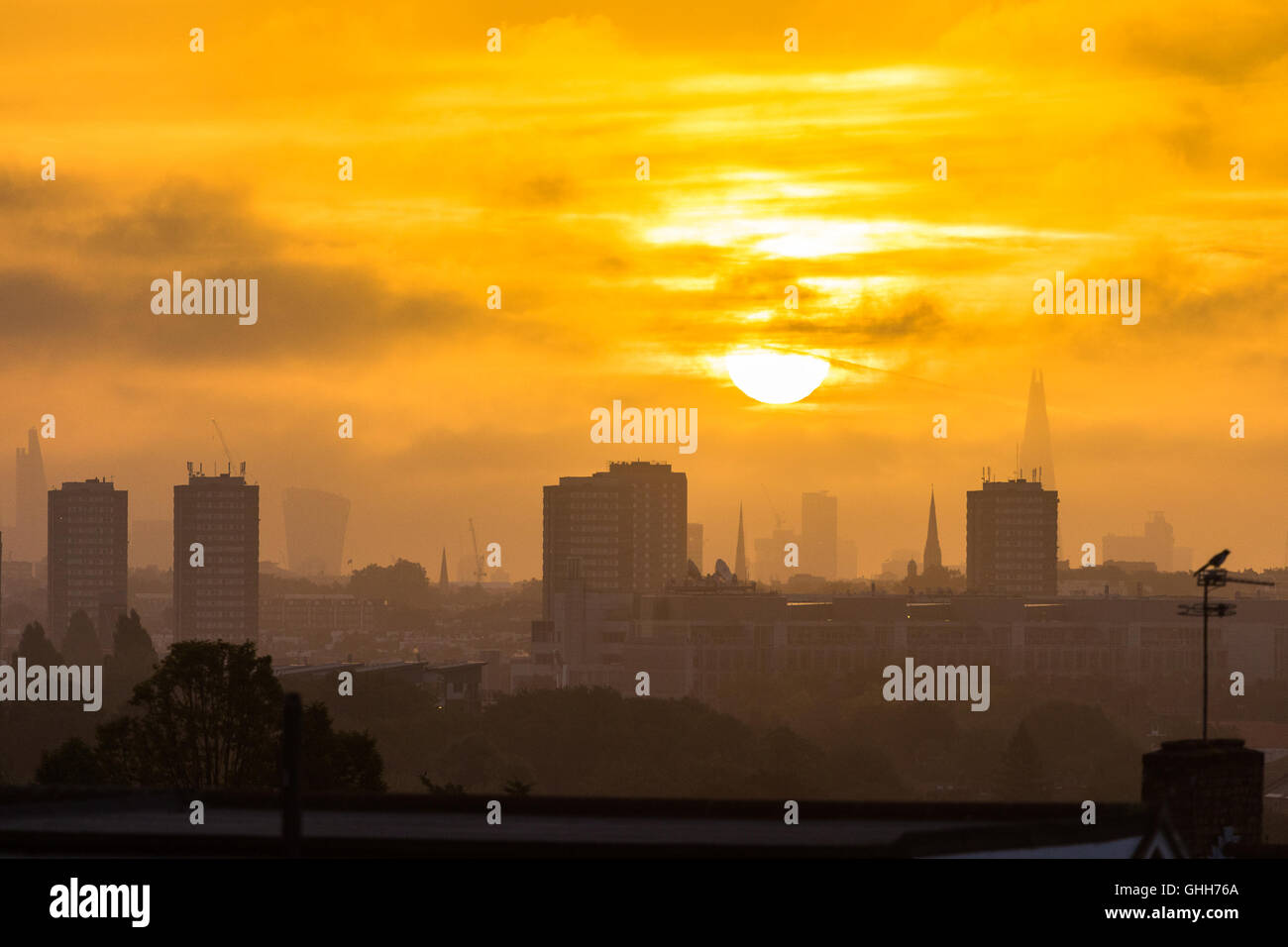 Acton, London, September 28th 2016. UK Weather: Distant skyscrapers in the city appear through the haze as a new day dawns in London, photographed from the A40 in Acton. Credit:  Paul Davey/Alamy Live News Stock Photo