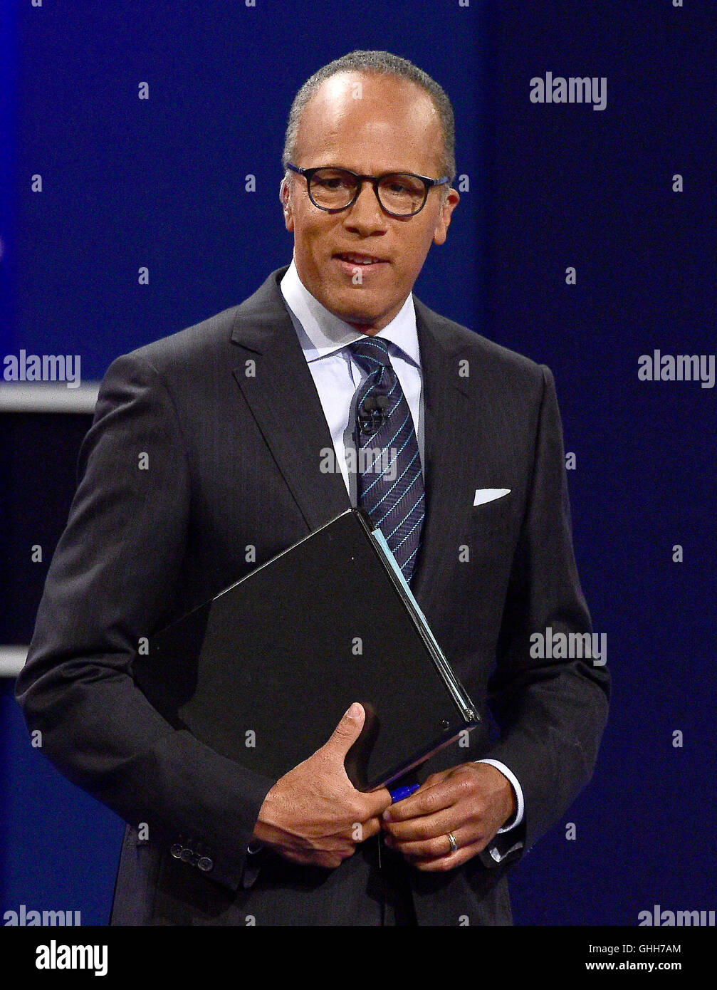 Hempstead, Us. 26th Sep, 2016. NBC Nightly News anchor Lester Holt addresses the audience prior to former United States Secretary of State Hillary Clinton, the Democratic Party nominee for President of the US and businessman Donald J. Trump, the Republican Party nominee for President of the US, appearing in the first of three presidential general election debates at Hofstra University in Hempstead, New York on Monday, September 26, 2016. Credit: Ron Sachs/CNP - NO WIRE SERVICE - © dpa/Alamy Live News Stock Photo