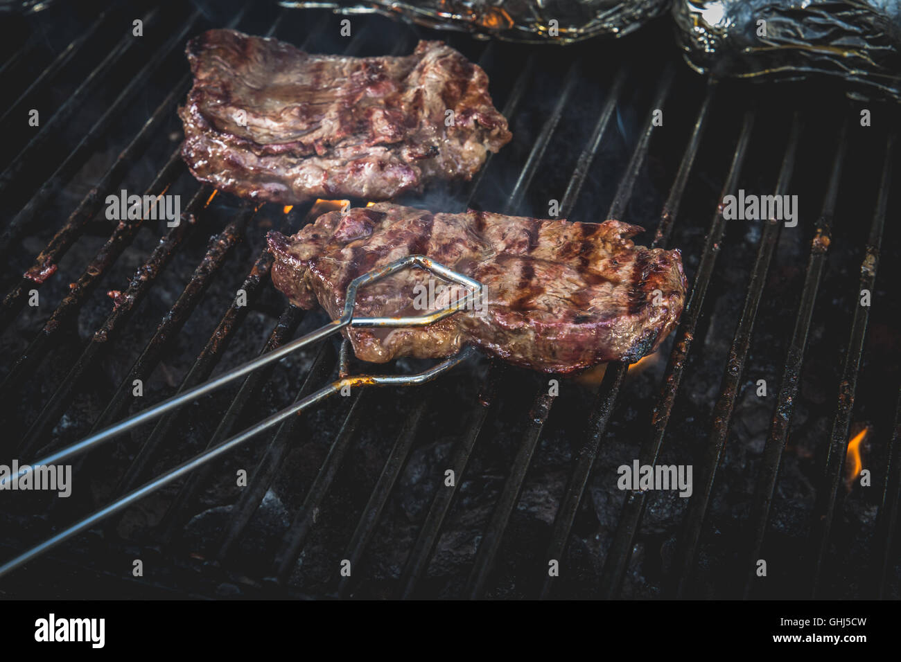 Sirloin steak on a bbq Stock Photo Alamy