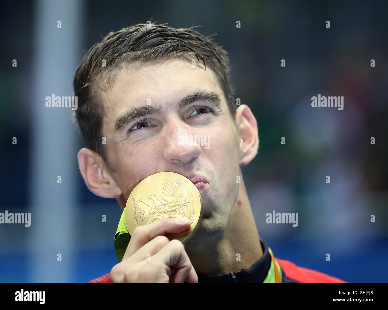 USA's Michael Phelps with his gold medal in the Men's 4 x 200m