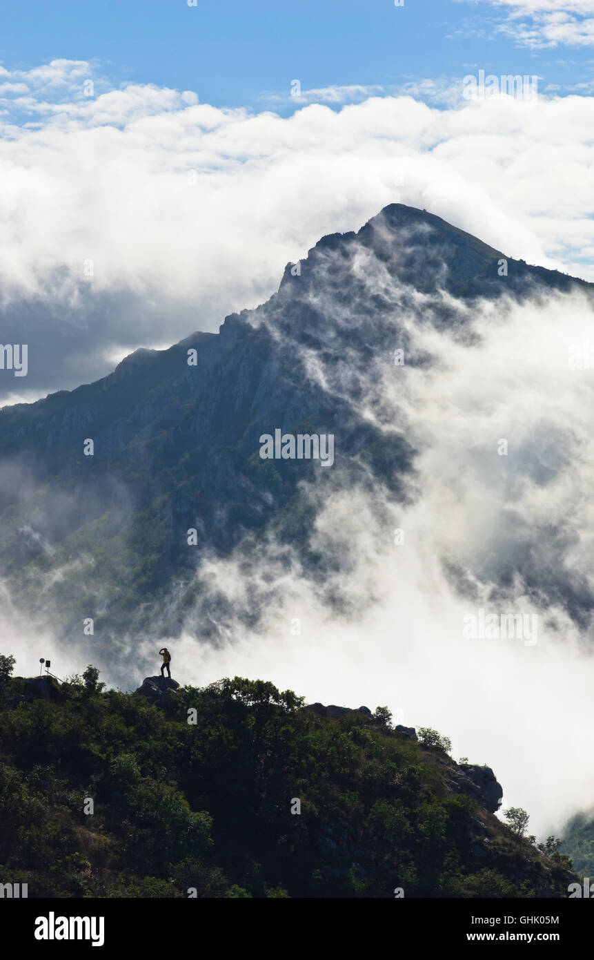 Mountain peaks of Suva Planina at morning covered with clouds Stock Photo