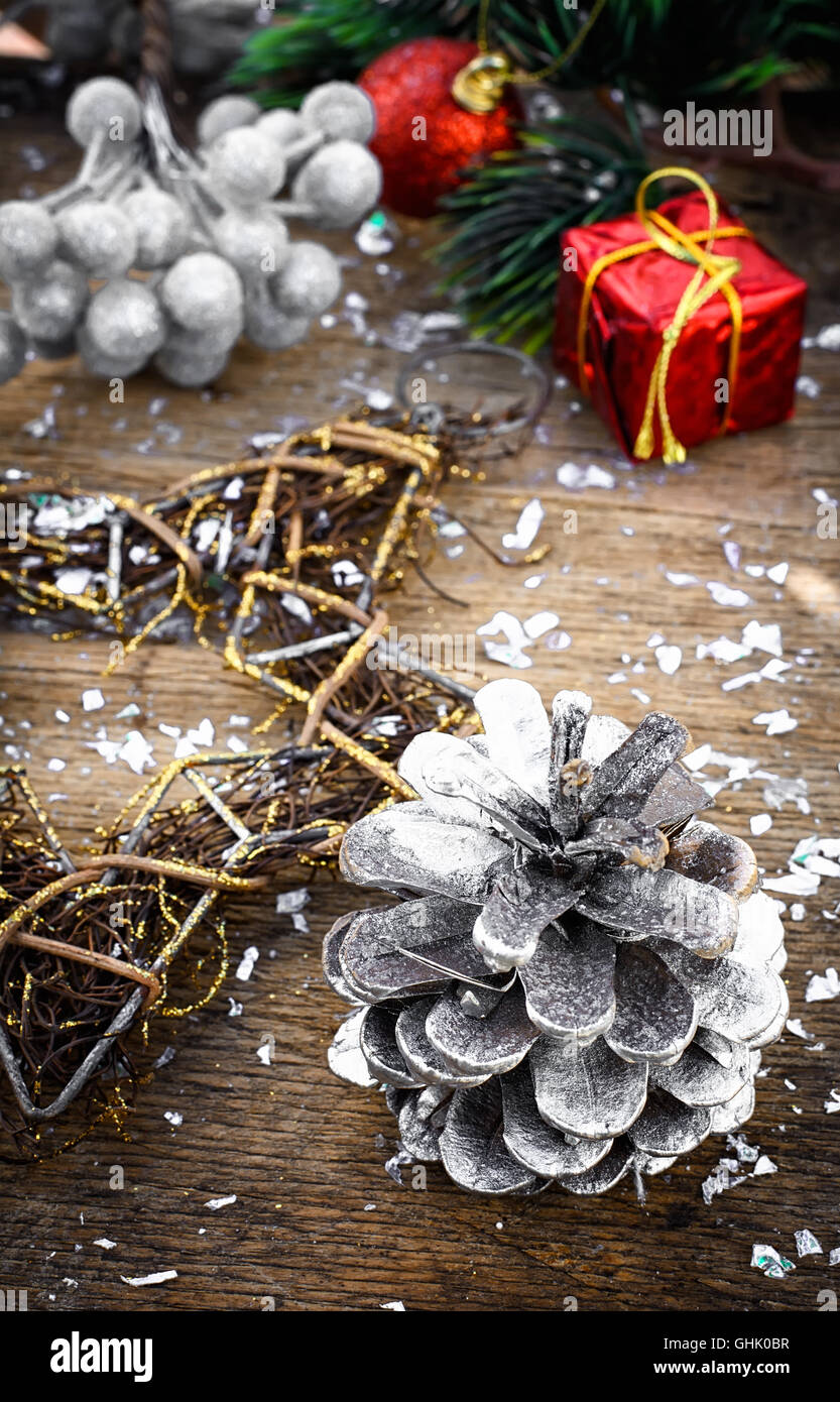 Painted pine cone and Christmas decorations with fir branch Stock Photo ...