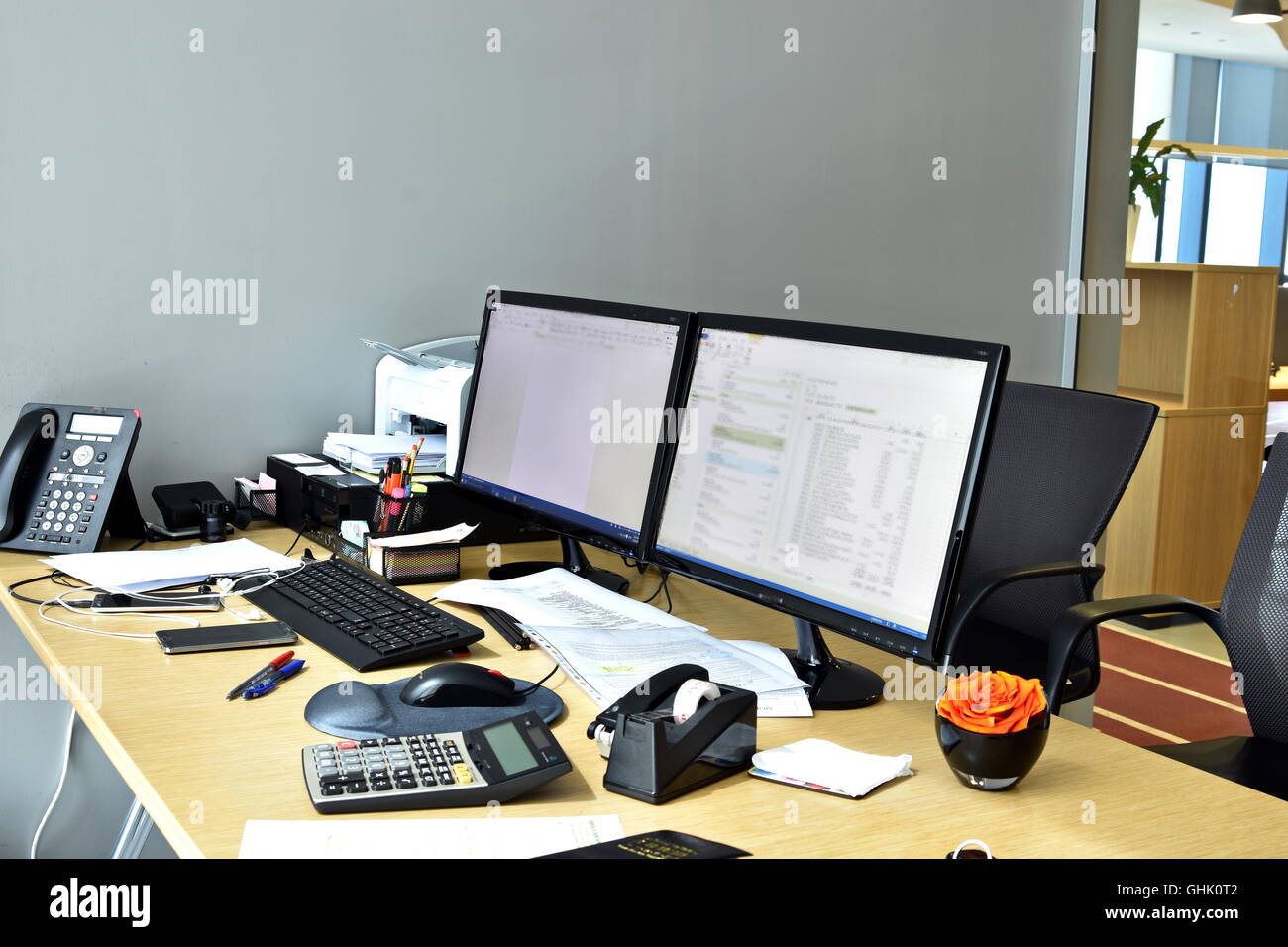 busy office desk with all items at the work Stock Photo