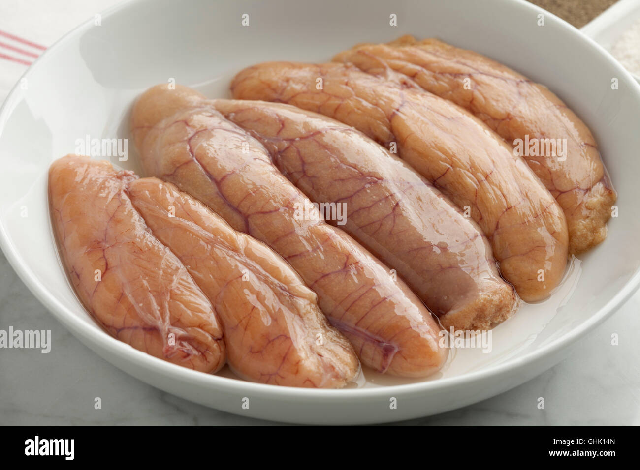 Raw whiting roe in a dish Stock Photo
