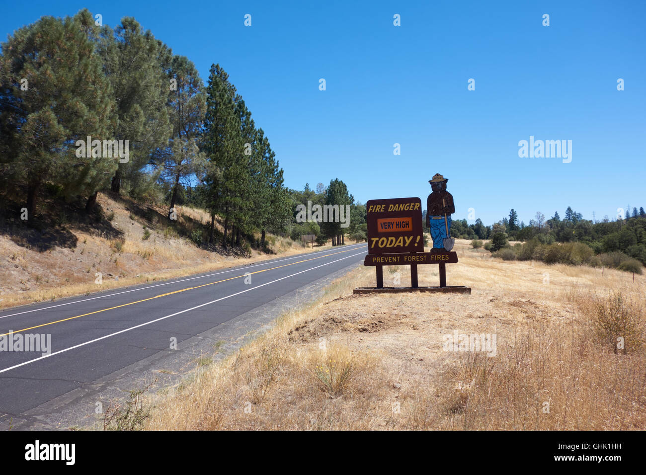 Yogi Bear Fire Warning sign at side of road. California. USA Stock